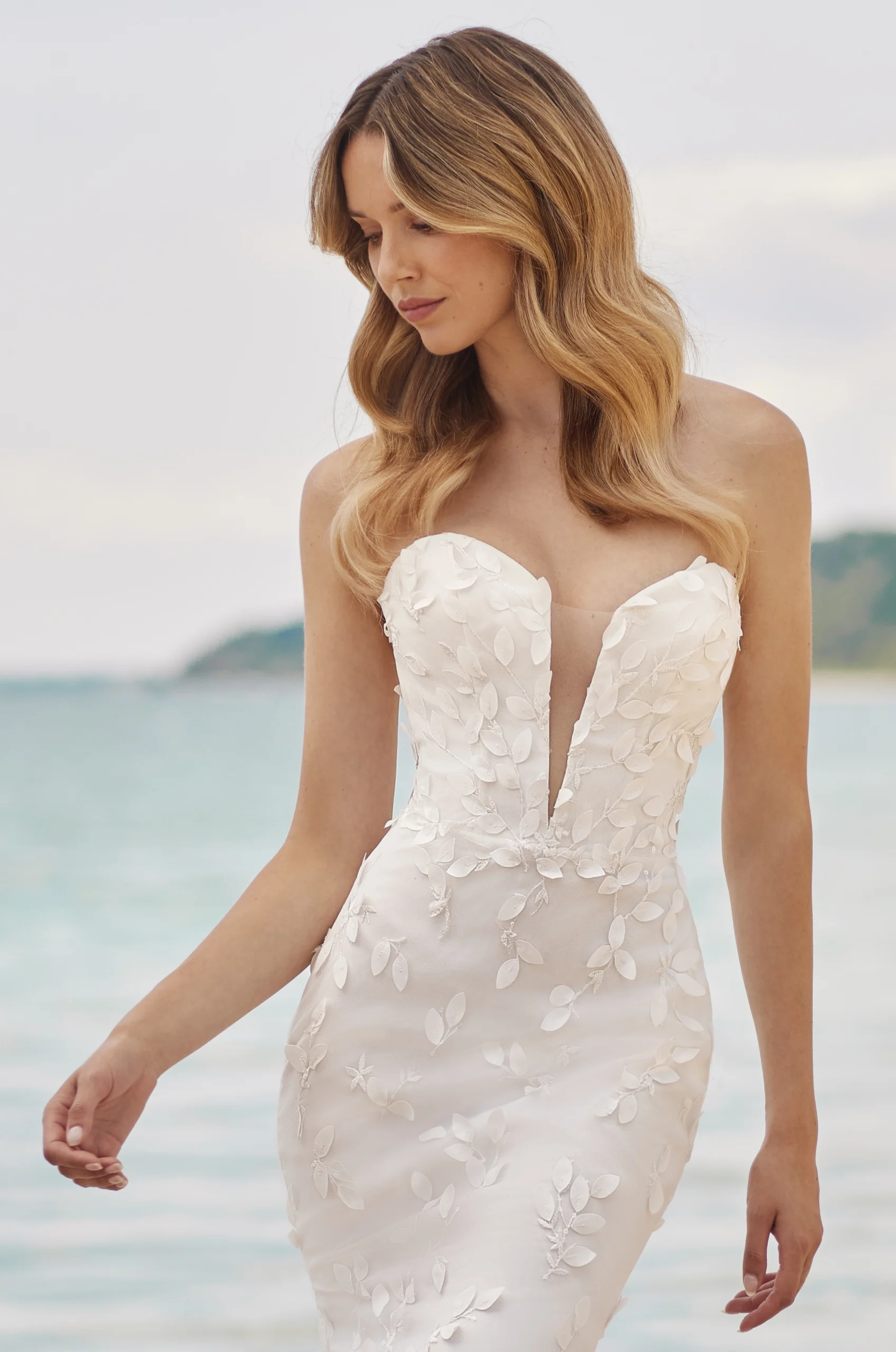 Video of new strapless stunner style M2481! This wedding dress features a chic lace bodice with plunging neckline.